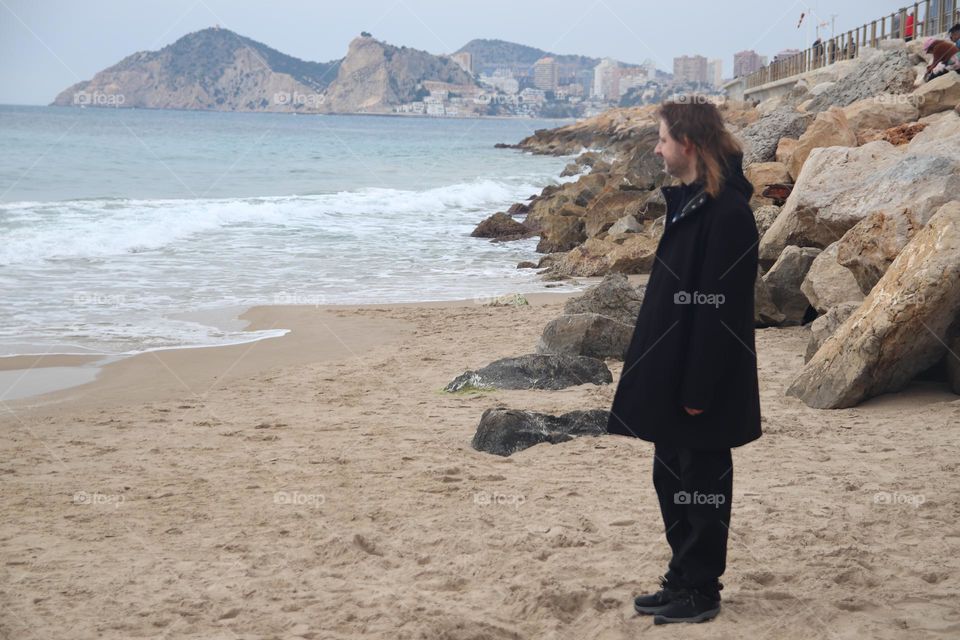 I am standing on the shore of the Atlantic Ocean, Spain. The city of Xsativa can be seen in the background