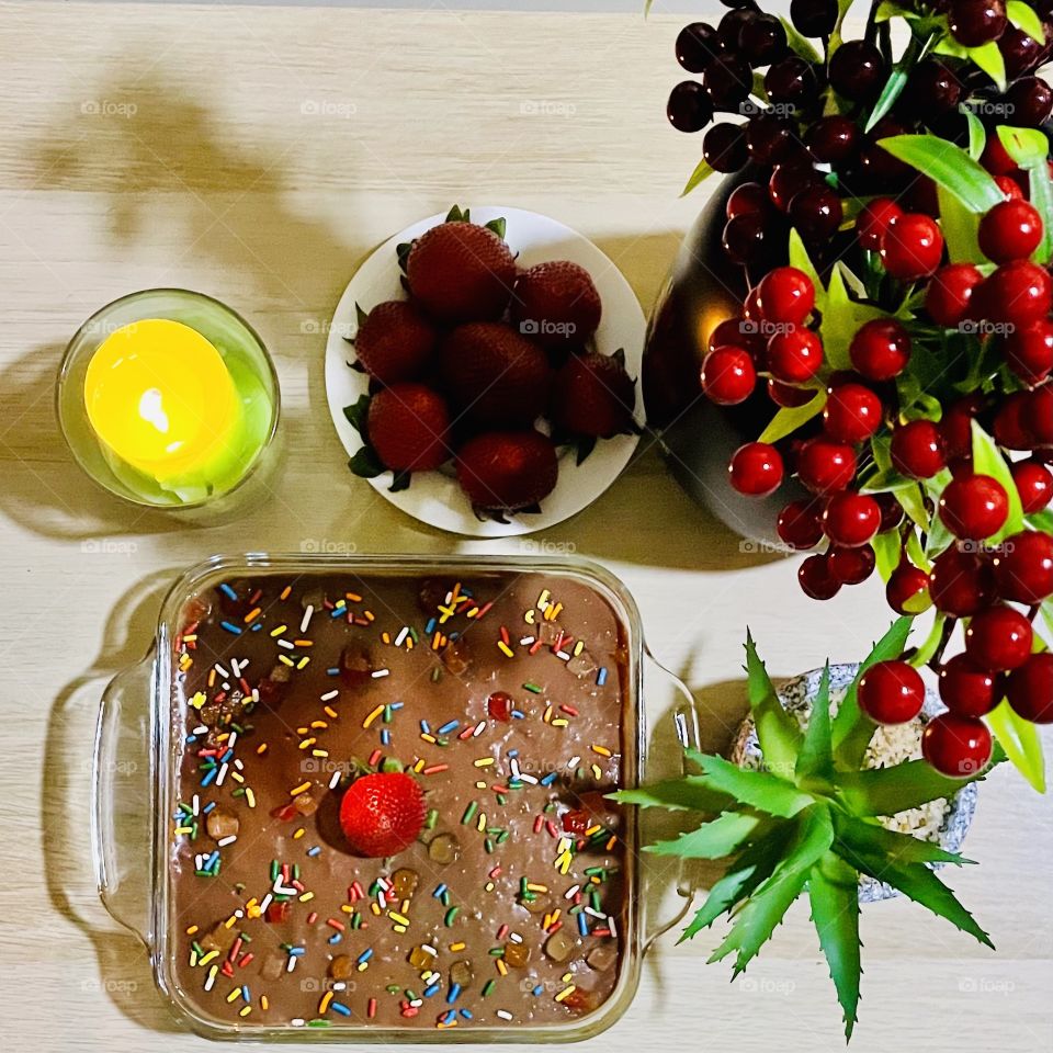 Chocolate Pudding cake and candle with strawberries 