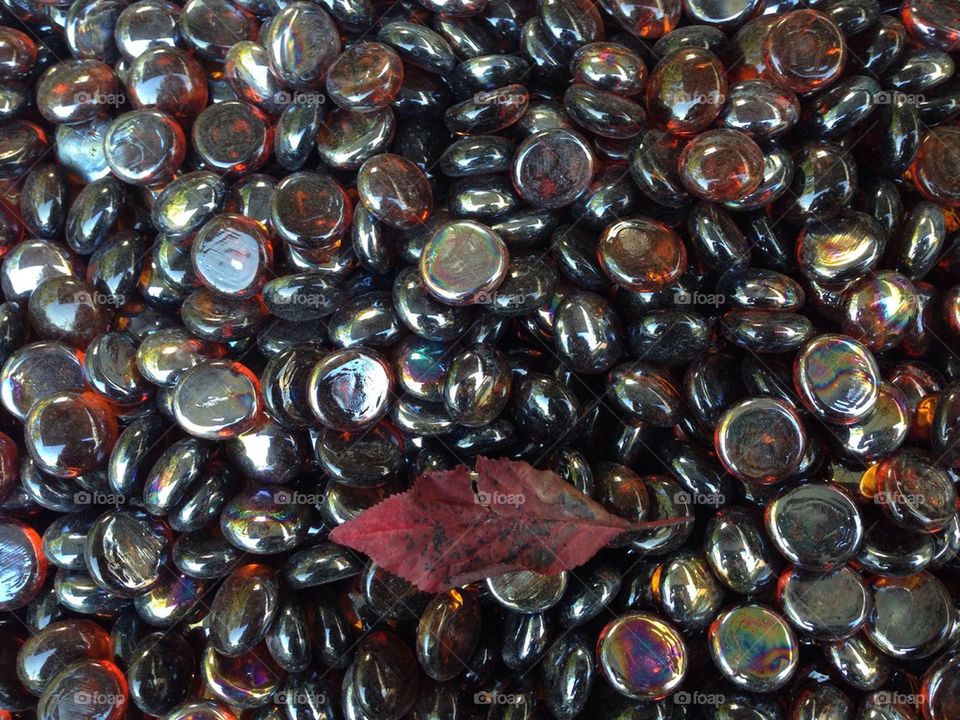 Glass beads and a leaf