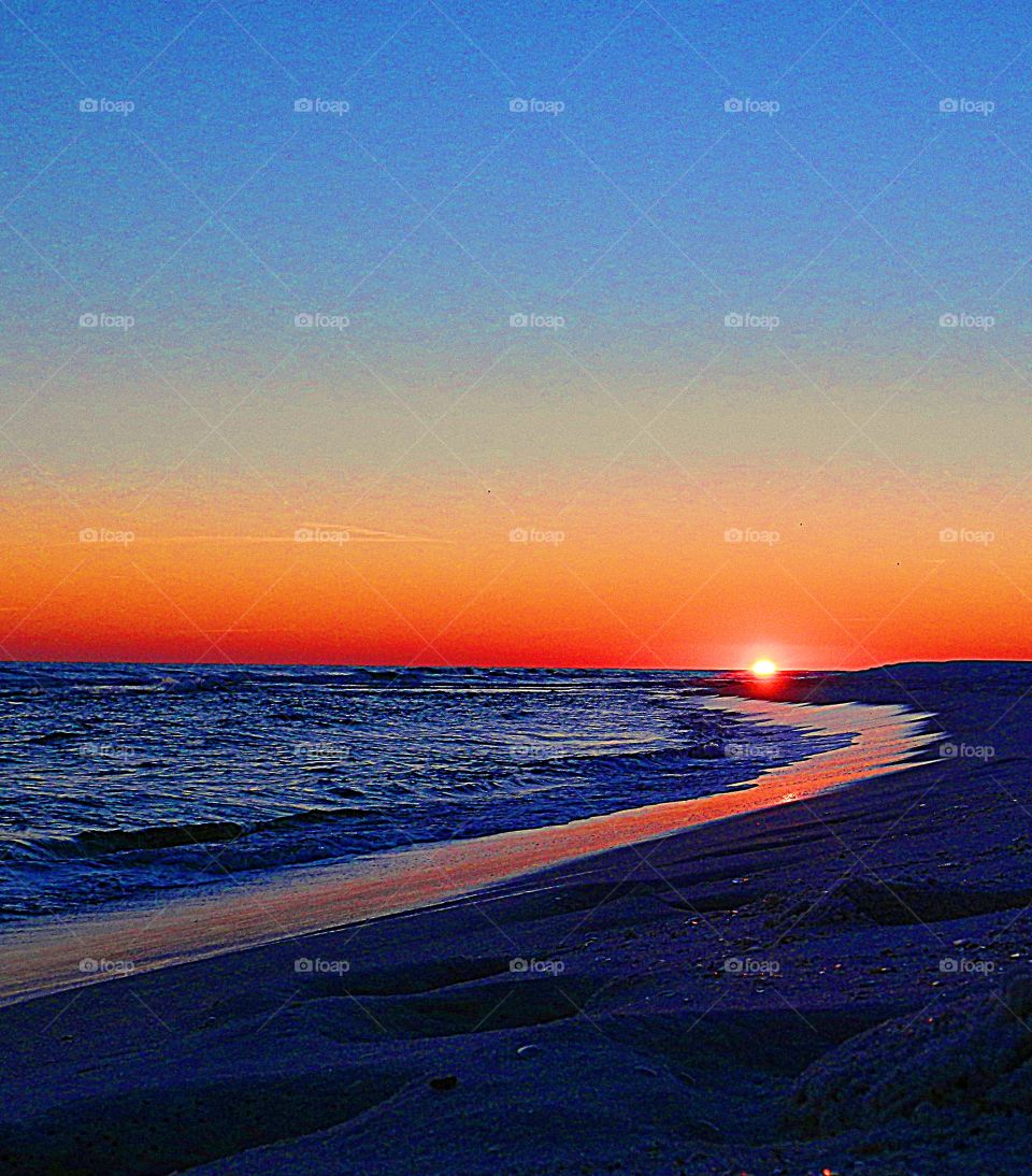 
the rays of an evening sun were lighted up with a golden radiance, glorious to behold, and increasing every moment in splendor. The sand on the beach was shimmering from the reflection sun ☀️