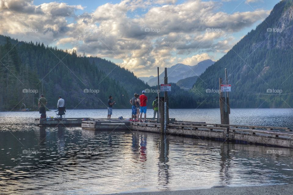 Fishermen on the dock at lake. Fishermen on the dock at lake