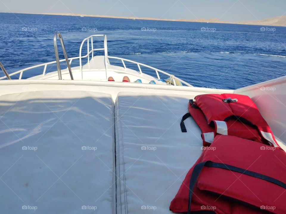 sailing on the boat with life jackets