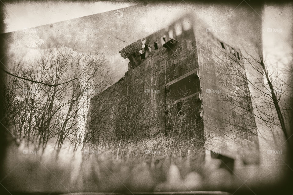 Old ruined concret building, Second World War period. Stylized on retro photo.