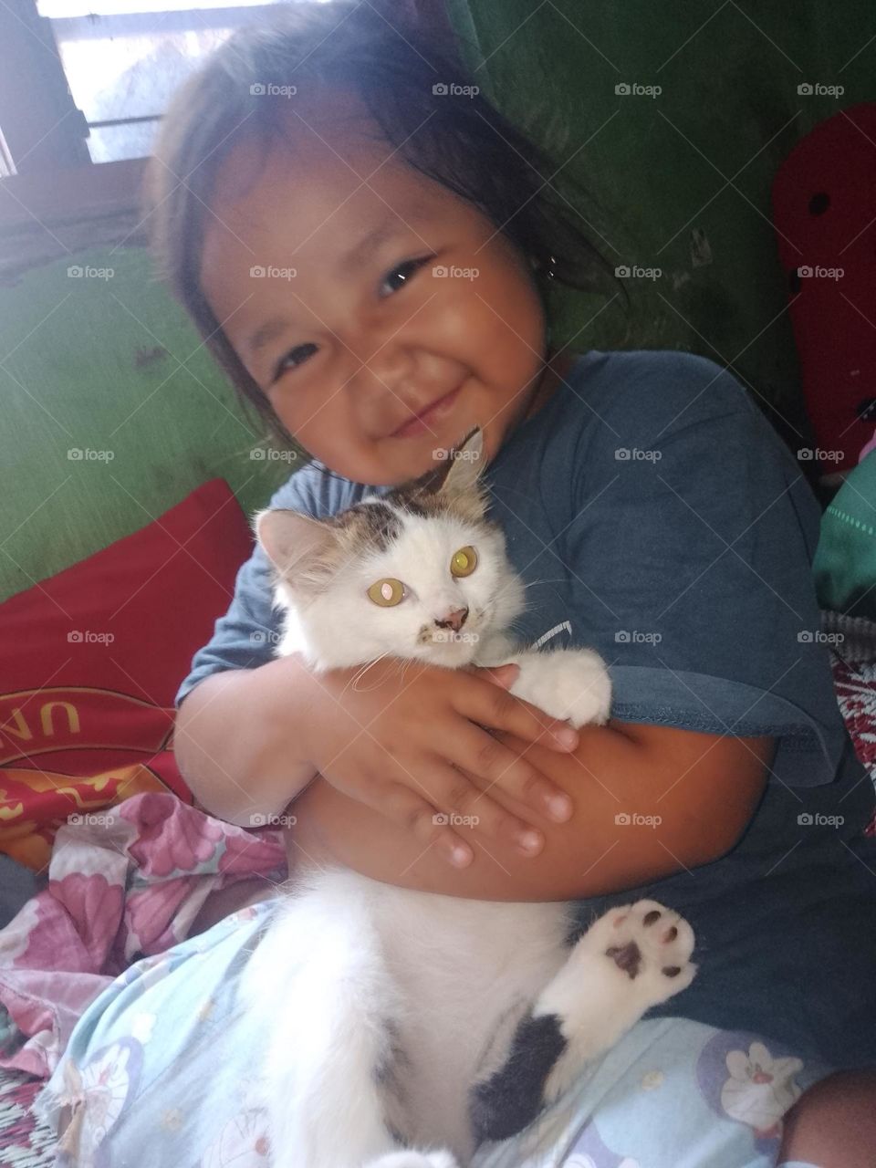 a child with a favorite cat