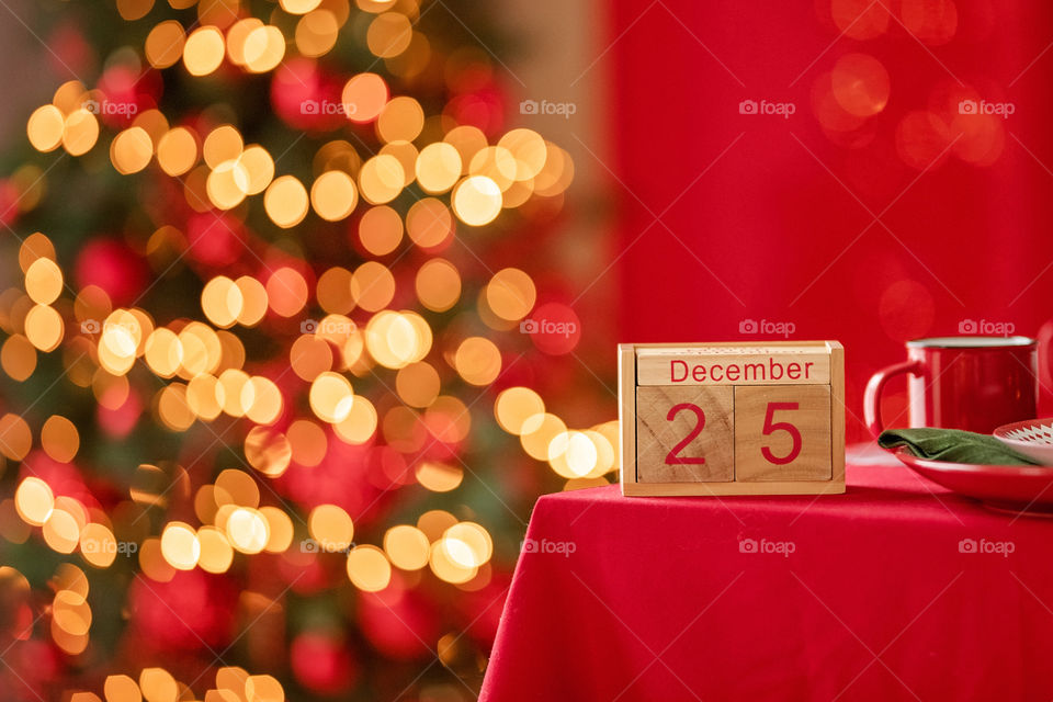 Christmas background with wooden block calendar with the date of December 25