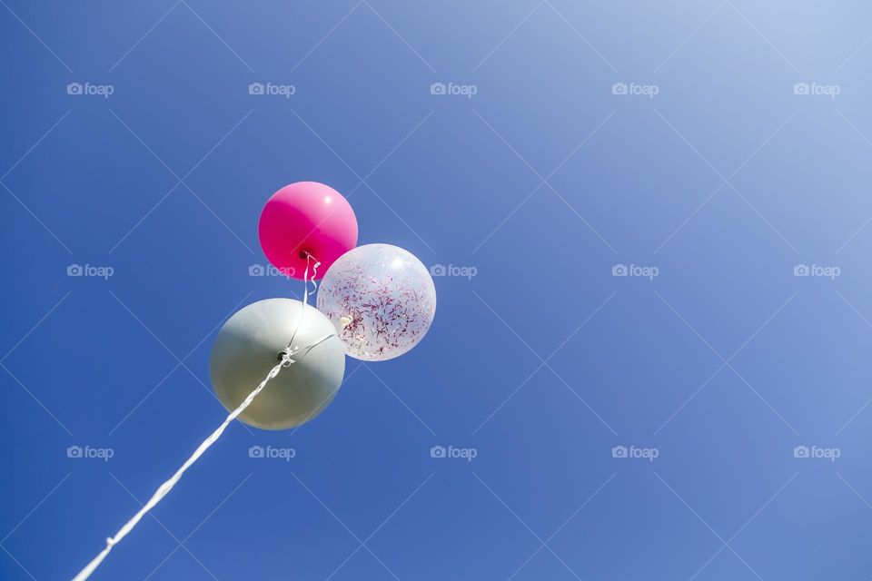 Helium balloons in the sky