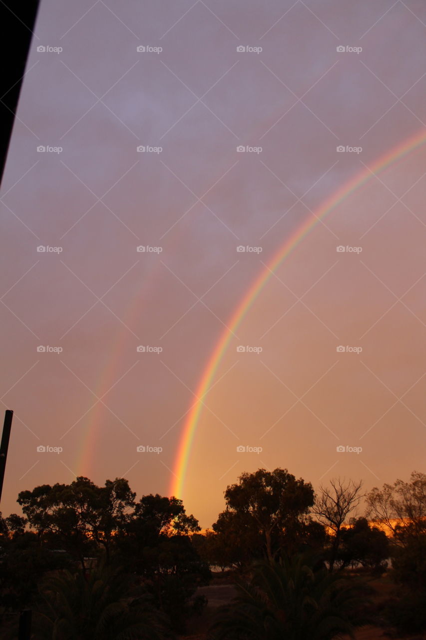 Two bright rainbows after a stormy afternoon