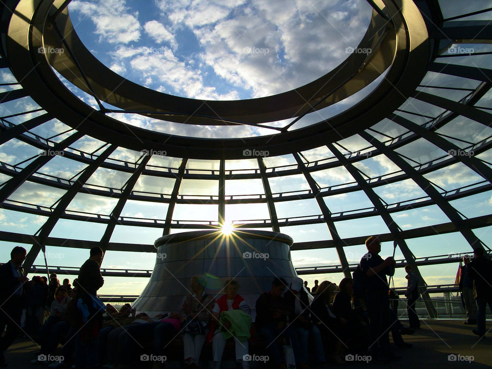 under the dome. visitors above the skyline of berlin