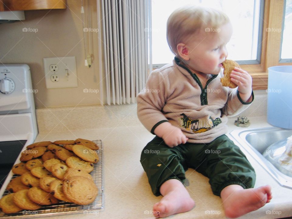 Darling little one year old eating his first Grandma chocolate chip cookie!! So yummy!! 