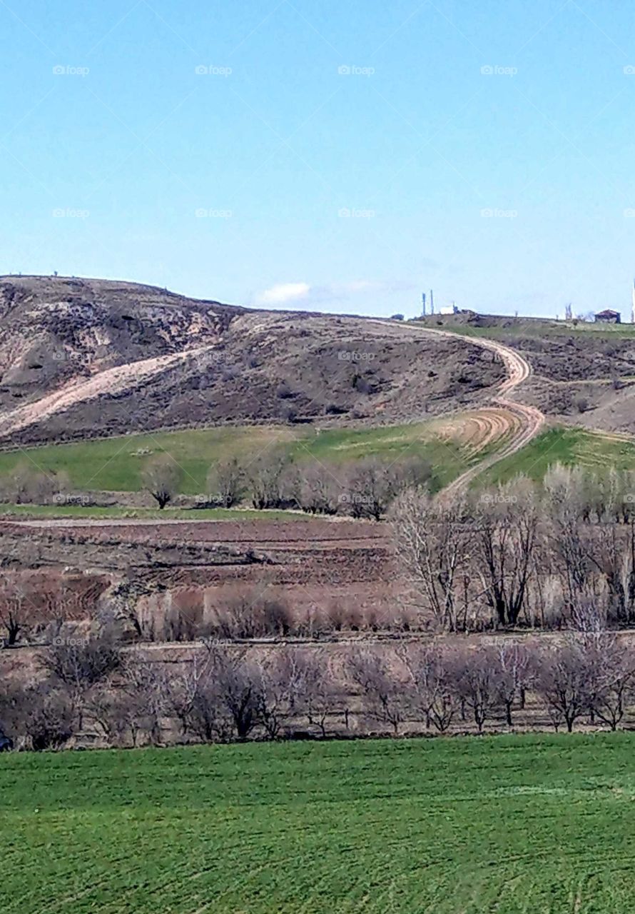 The countryside landscape. from high hill to low farm(or cropfield), has different levels, this scenery is a specil beauty.