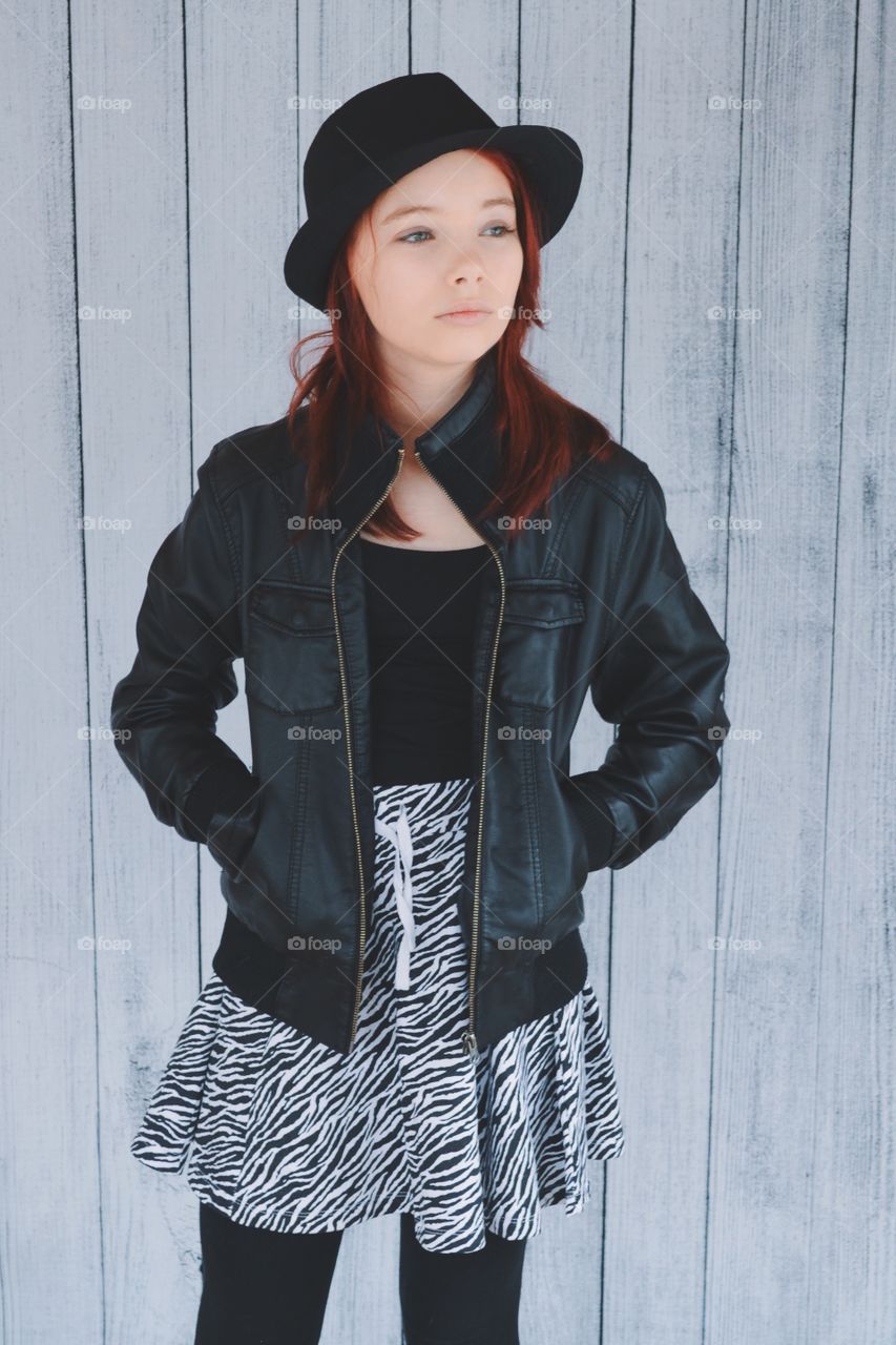 Girl in leather jacket and hat