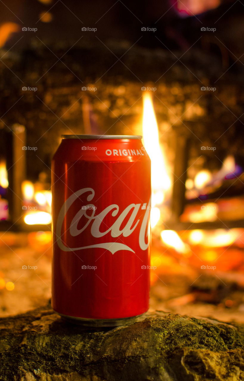 Enjoy a nice Coca-Cola in front of a warm fire