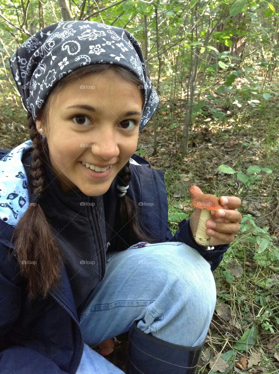 Girl holding mushroom in hand