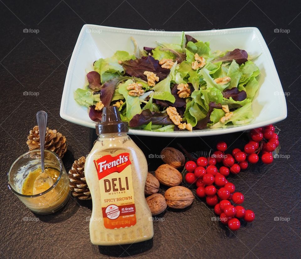 Fresh mixed green salad with walnuts and a French’s mustard vinaigrette.
