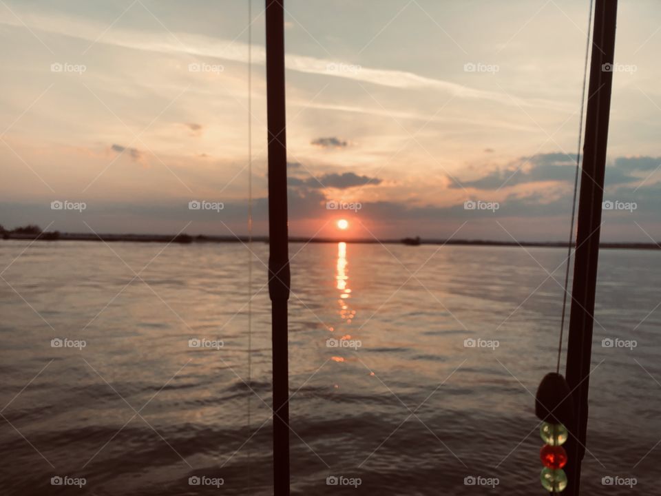 Rectangle fishing poles with sunset in the back ground! Shapes rectangular, sunset, beautiful 