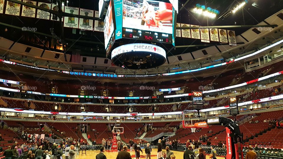 Chicago Bulls American NBA basketball team United Center sports arena during game.

The stadium seats about 20.000 spectators on a basketball game.