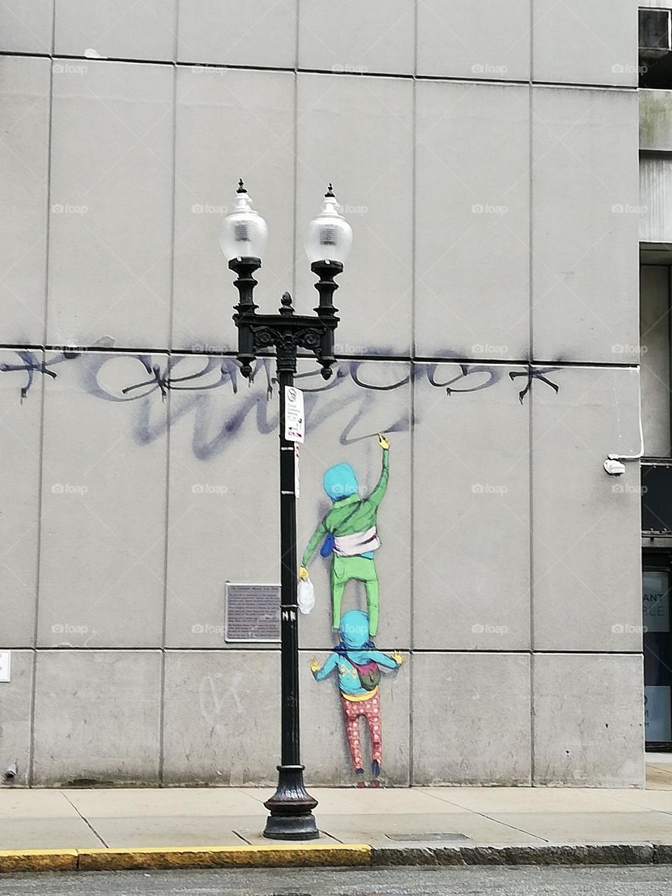 Children painting wall . New York street art 