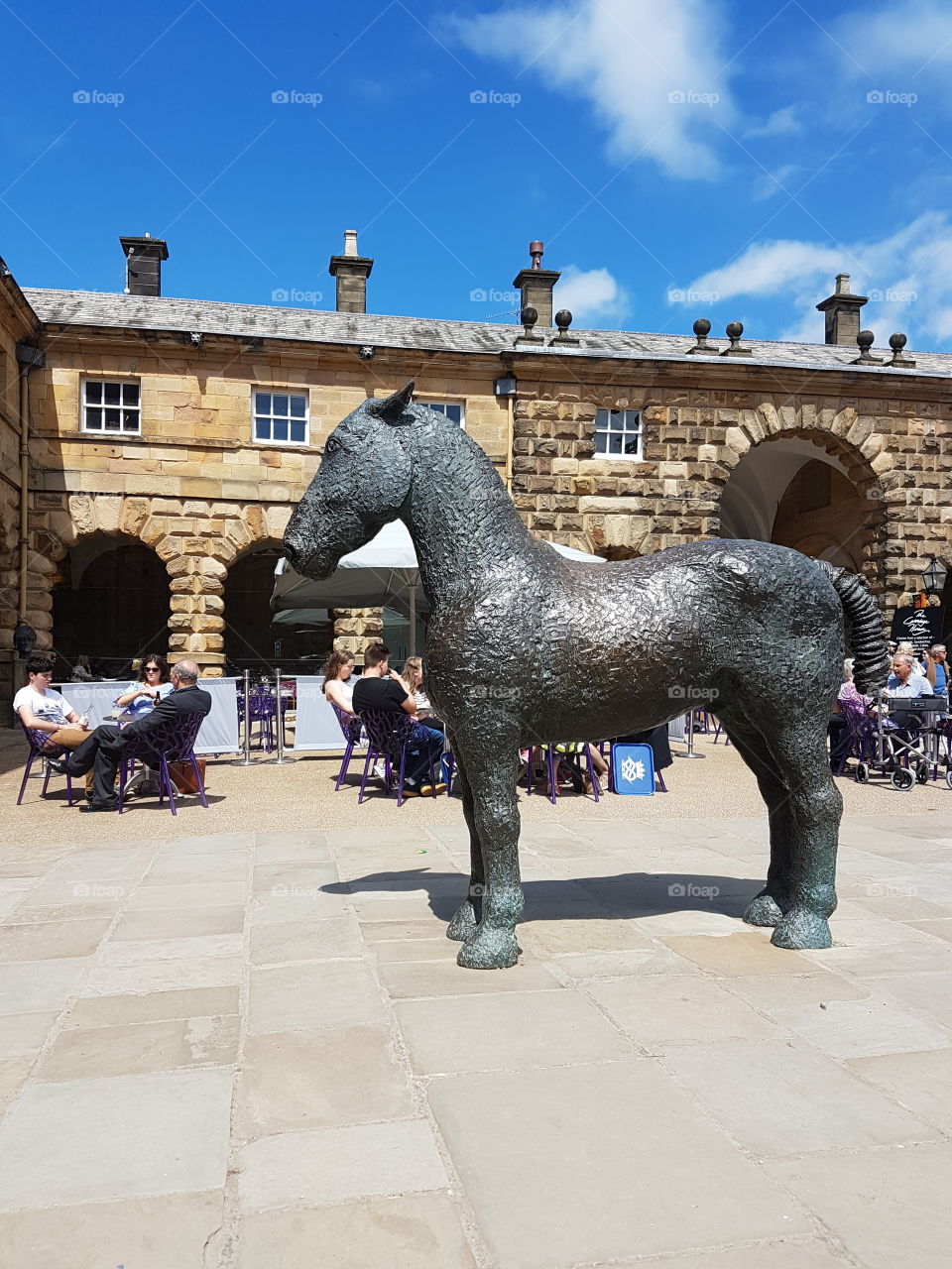 Very large cast iron horse sculpture in a courtyard in England