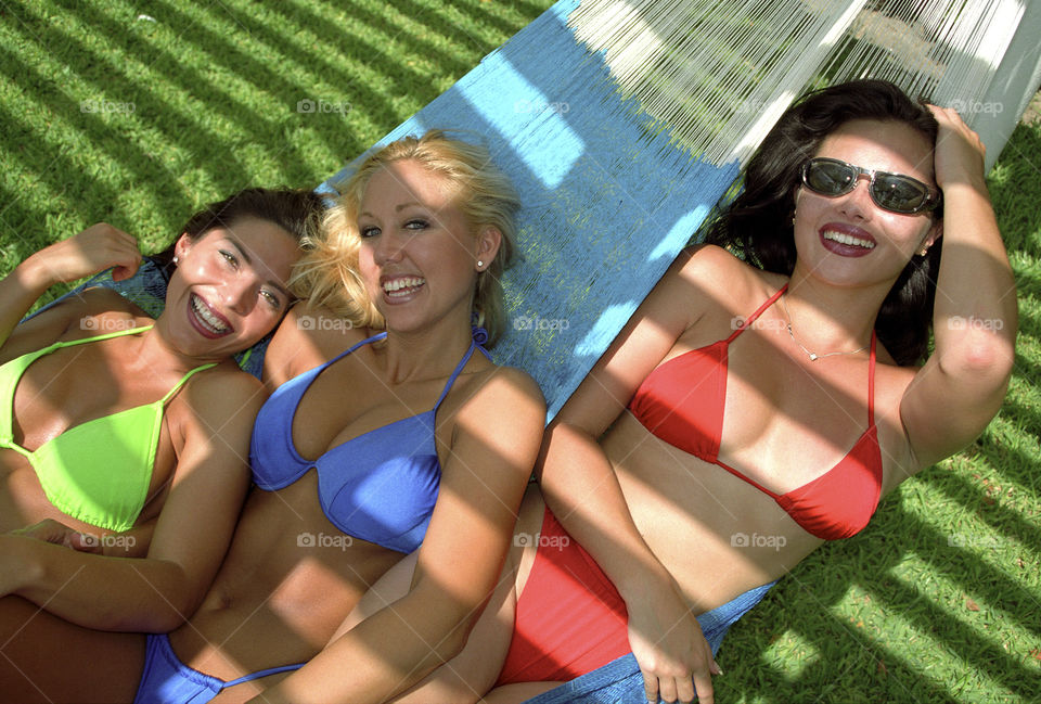 Group of friends having fun on hammock