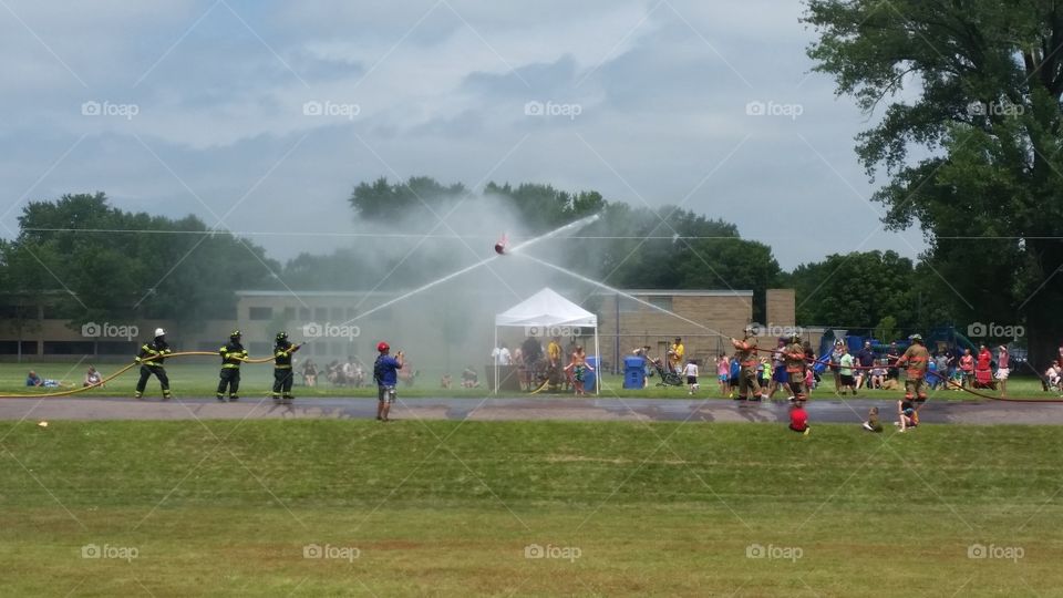 firefighters at play. water wars with firefighters