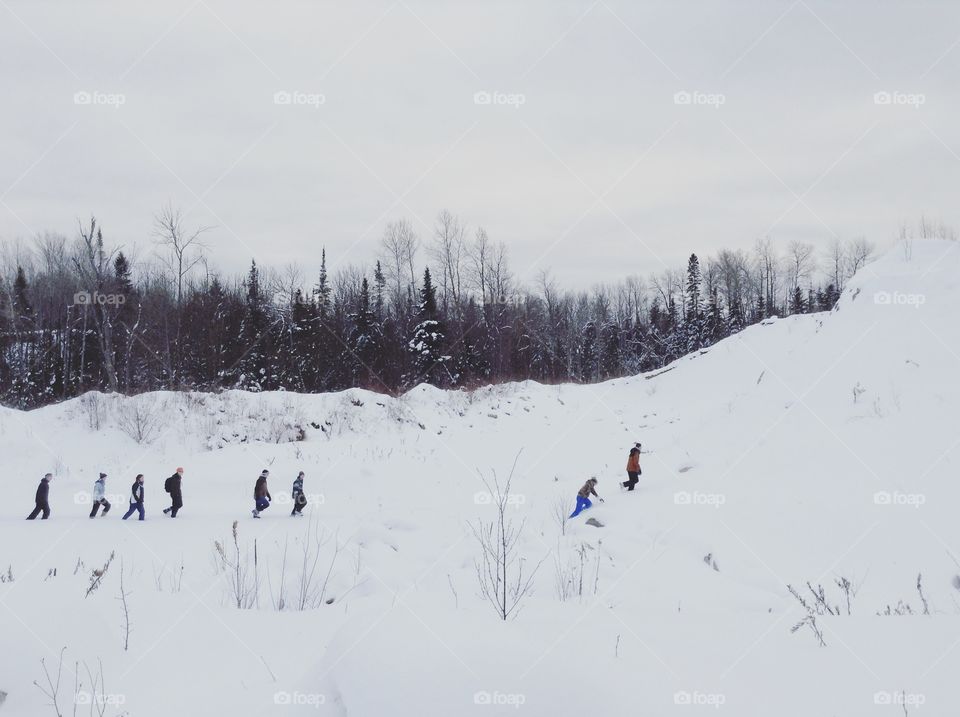 Group of people hiking in the snow