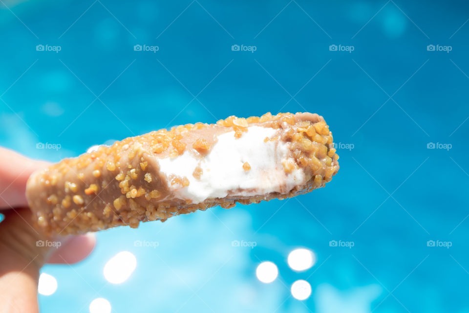 Having a delicious ice cream by the pool 