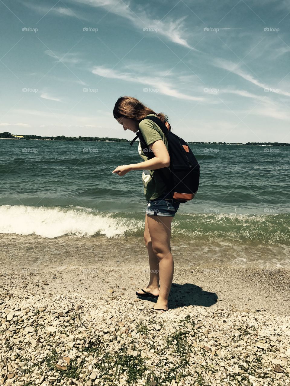 Side view of woman standing on beach