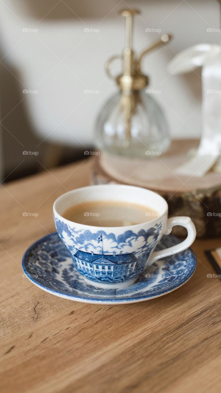 coffee in vintage dishes, namely in a vintage cup