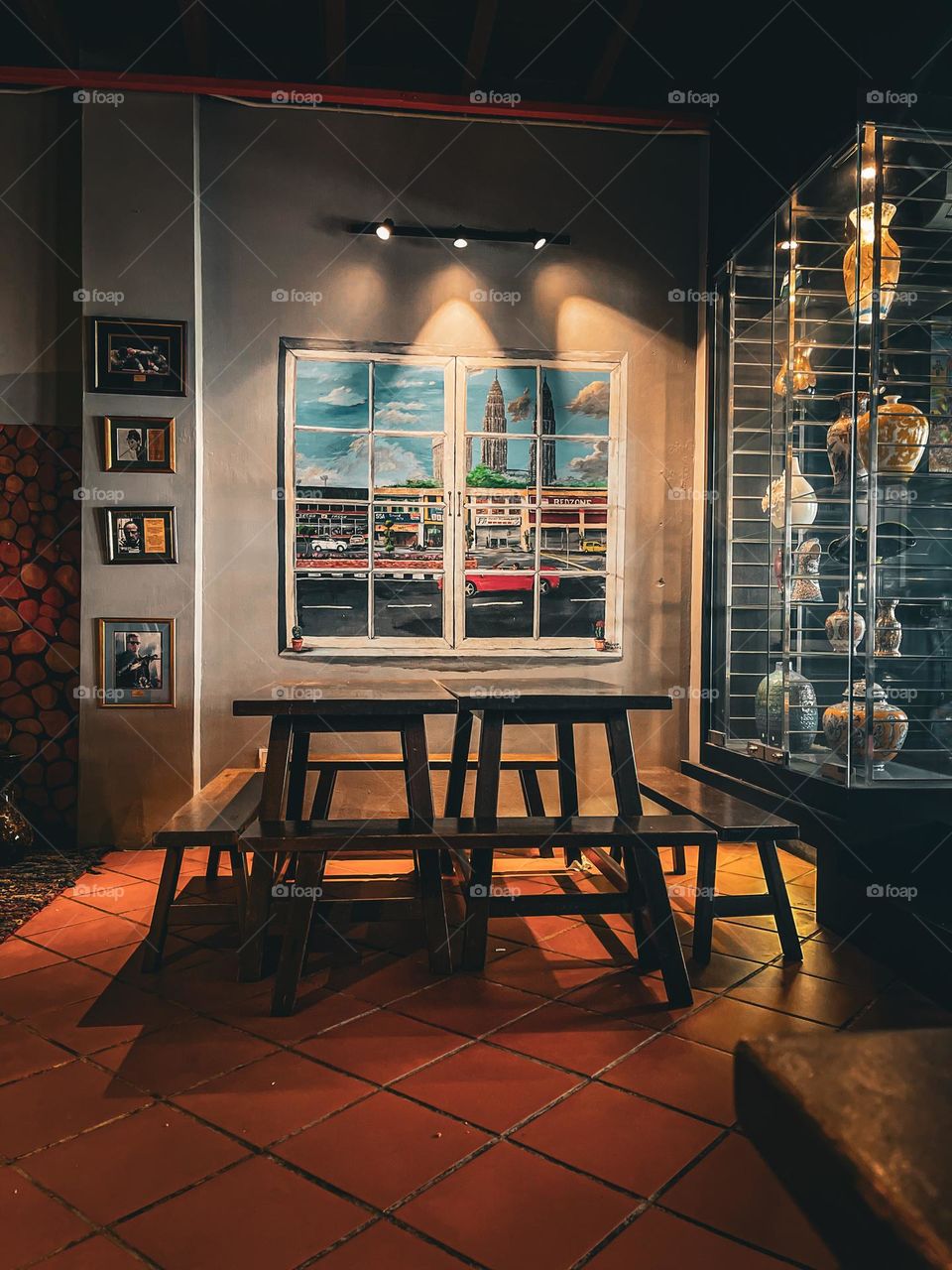 Vintage wooden seating painting display and focus lighting indoor at a local coffee shop