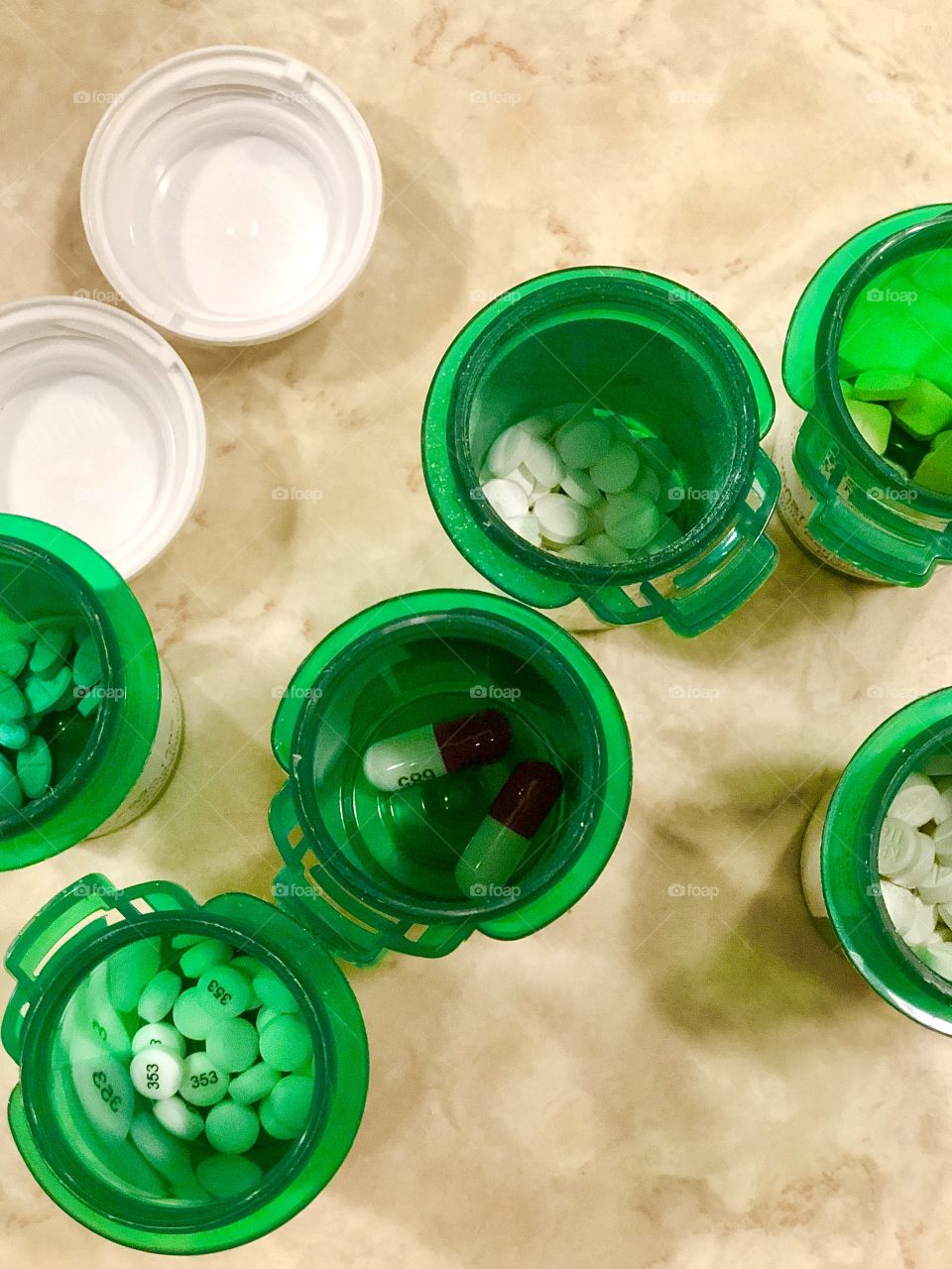Overhead view of pill bottles on countertop 