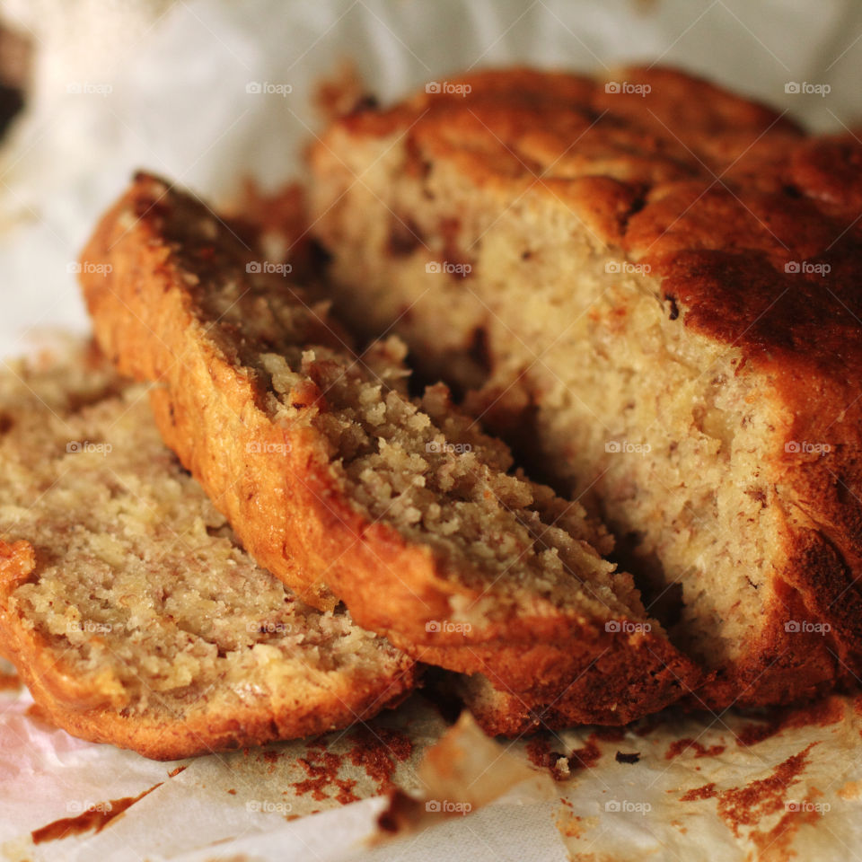 Homemade sliced banana muffin on pastry paper