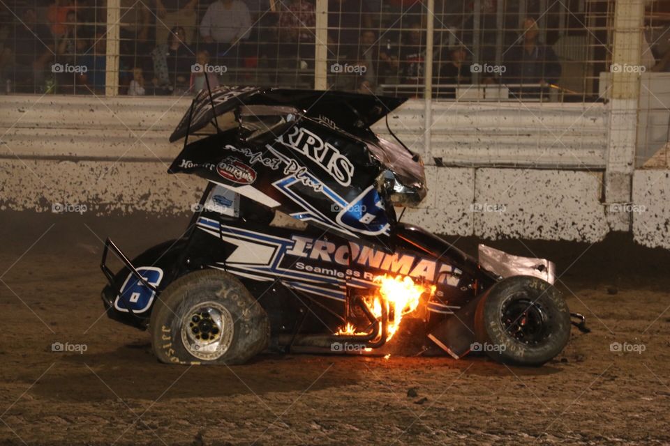 Outlaw Sprint Car race car on fire after a crash in Grand Forks North Dakota 
