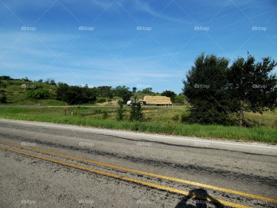 hay truck 🚚 passing 2. This is another picture of the same hay truck 🚚 passing that I saw while out exploring