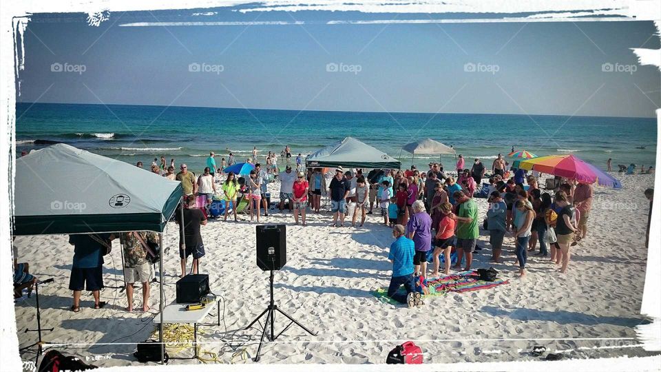 Praying on the beach...a sight not too common but impactful on all who see.