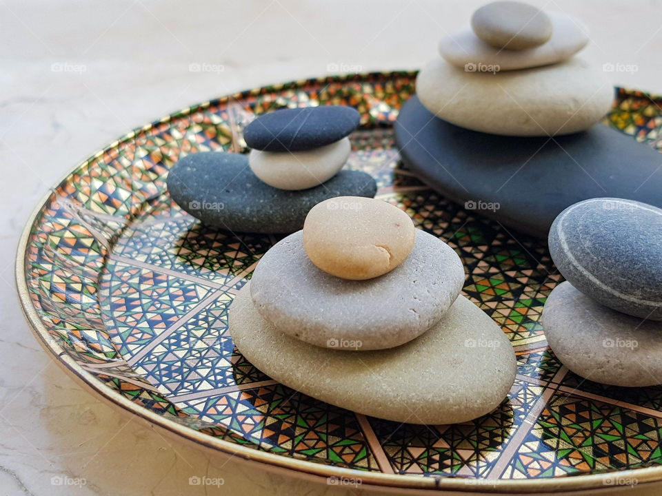 colourful pebbles arranged on a beautiful plate