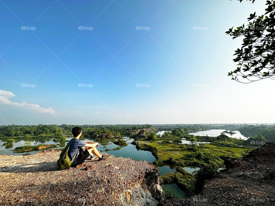 Relaxing and enjoying the view of our earth below and sky above with no edge and border.