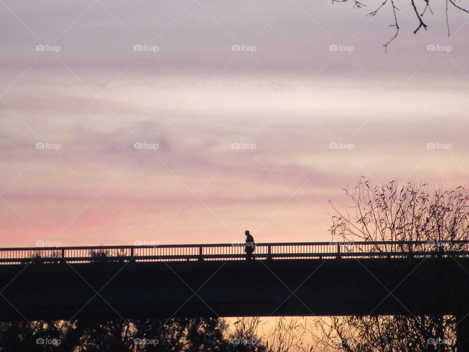 Crossing bridge at sunset
