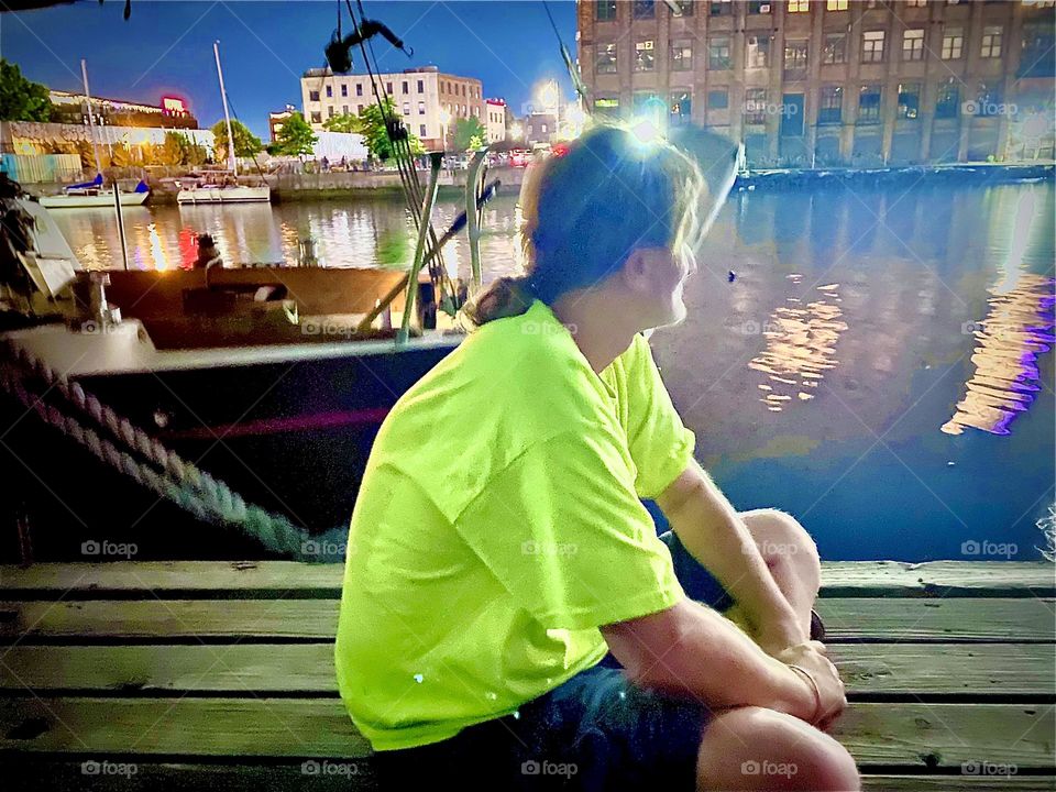 On the evening of “July 4th” 2022 Timothy is looking down towards several boats on the “East River” where the fireworks are being prepared to launch at 9:30 PM sharp. Hypnotic Productions