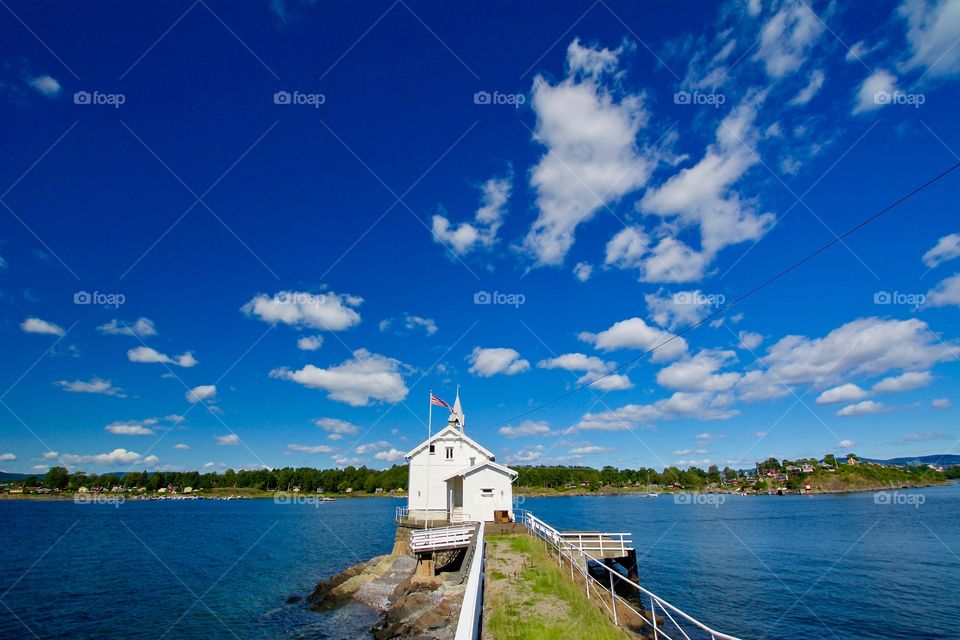 The stunning lighthouse at Gressholmen in Oslo in fair weather 