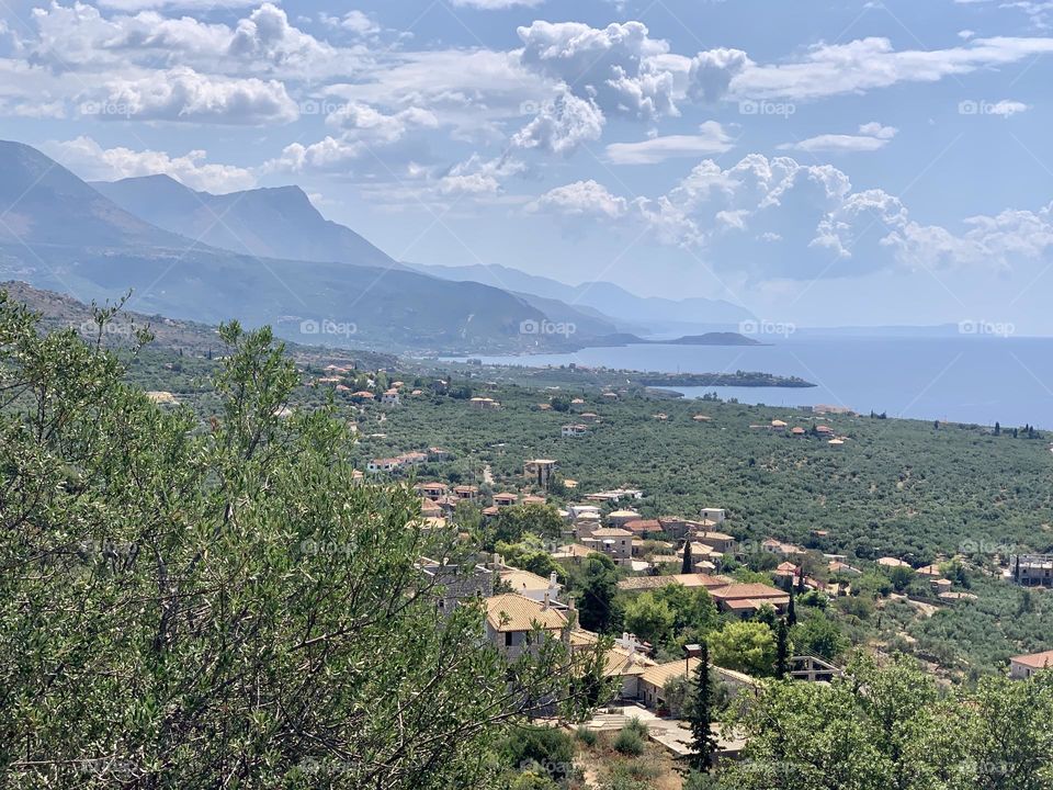 Greek coastline with mountains in the distance 