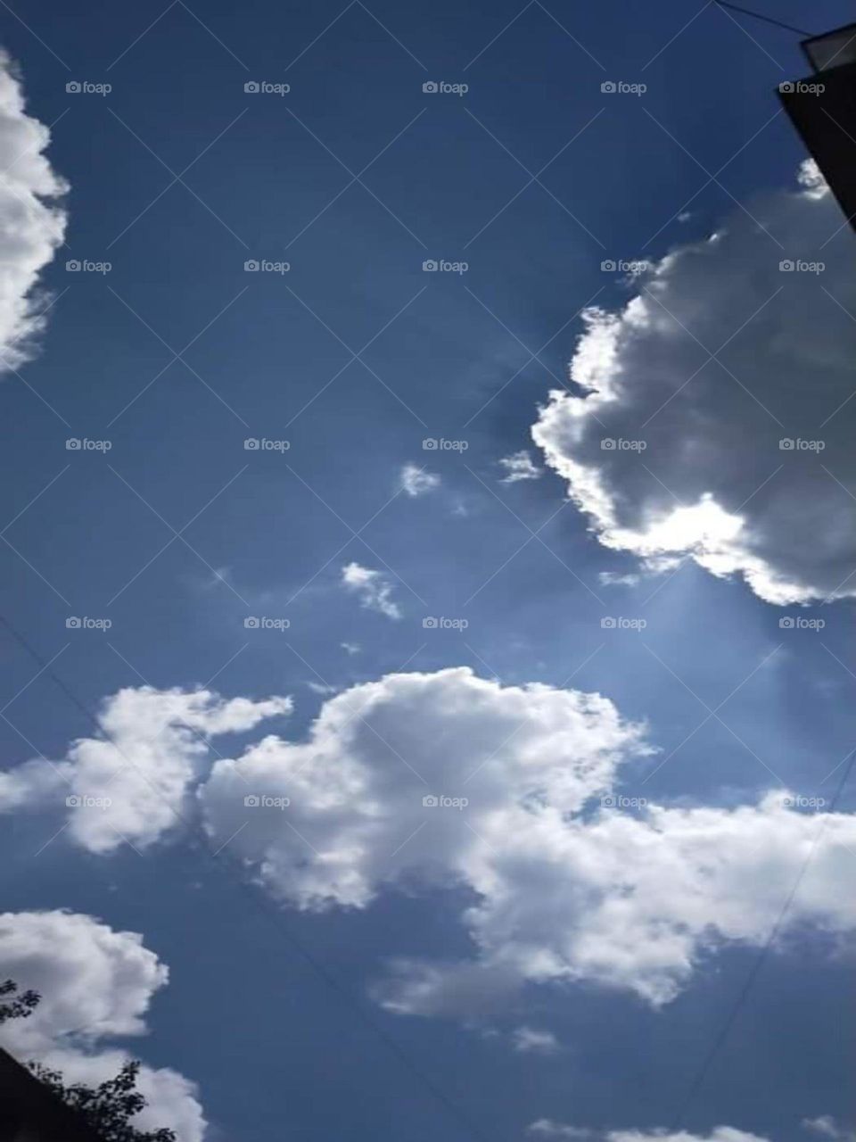 Cumulus clouds look like fluffy, white cotton balls in the sky. They are beautiful in sunsets, and their varying sizes and shapes can make them fun to observe! Stratus cloud often look like thin, white sheets covering the whole sky.