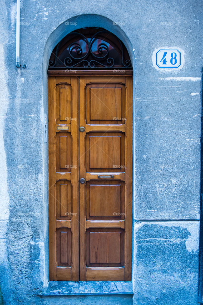 Old door in the city of Cefalu on Sicily.