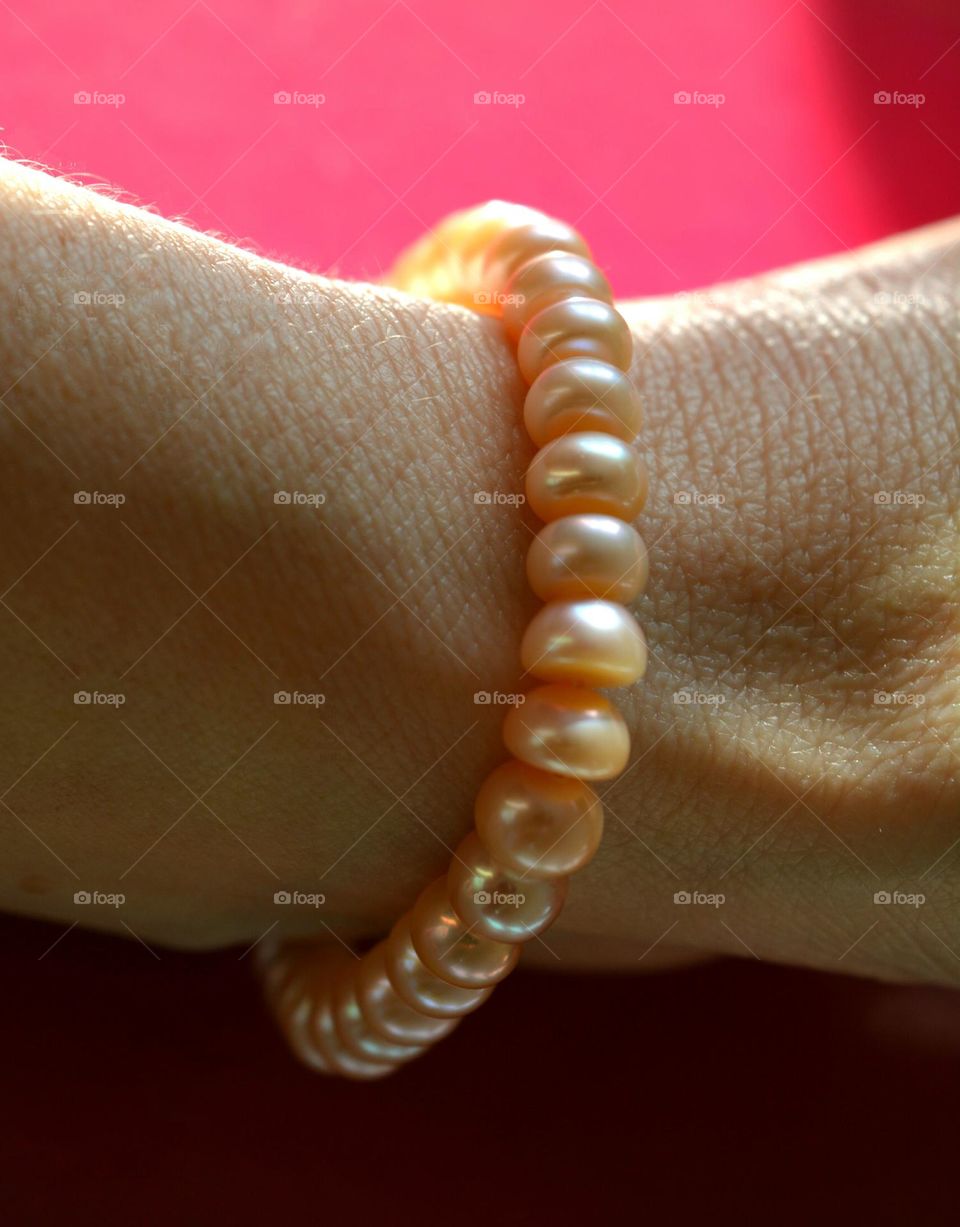 female hand with bracelet pearls beautiful accessories