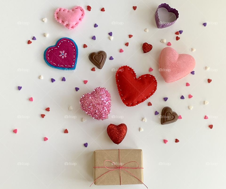 Multicolored hearts with confetti & gift