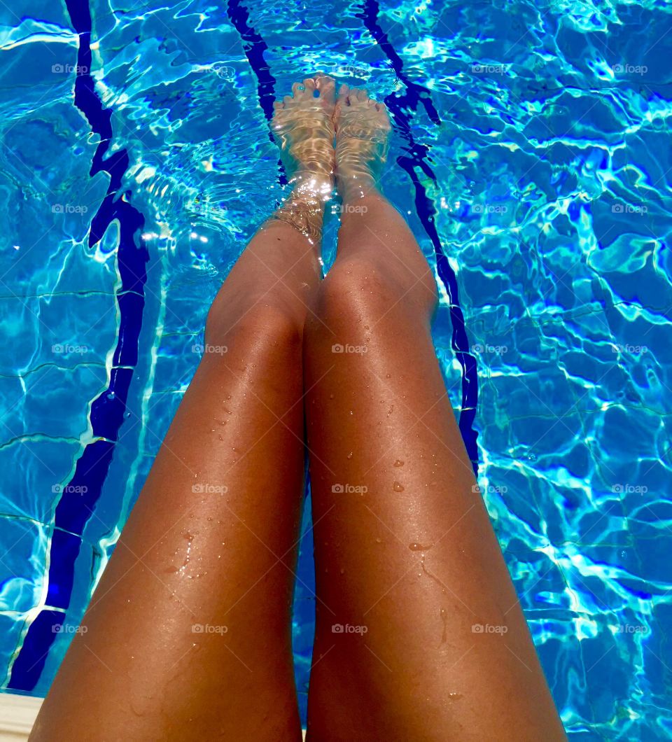 Foot dips in the pool
