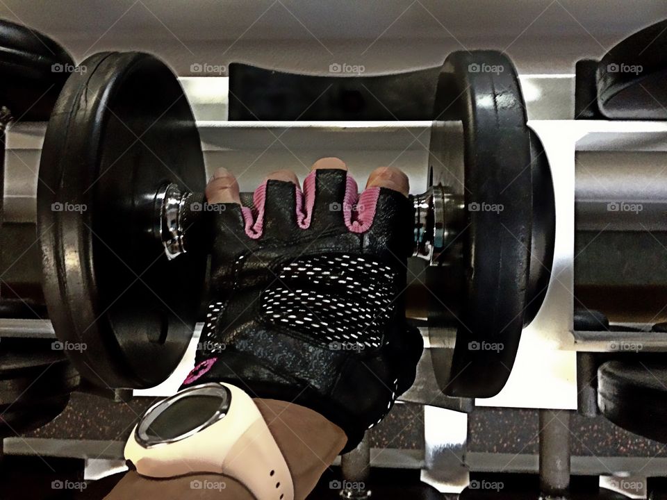 Weight lifting in the gym to build muscles and strength.