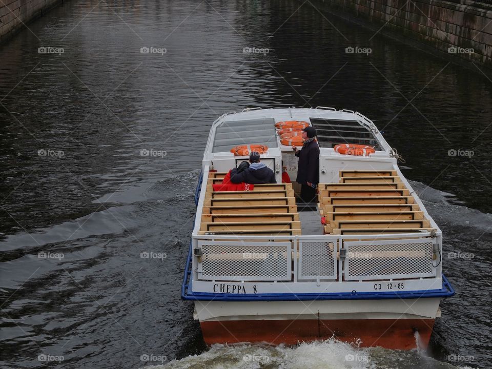 Note ride. 

This boat goes on one of the canals in St Petersburg. 