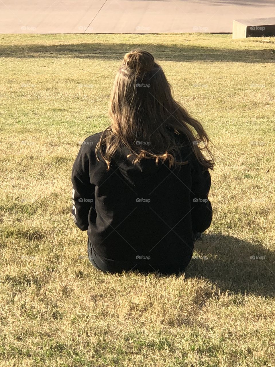 Girl sitting on the grass