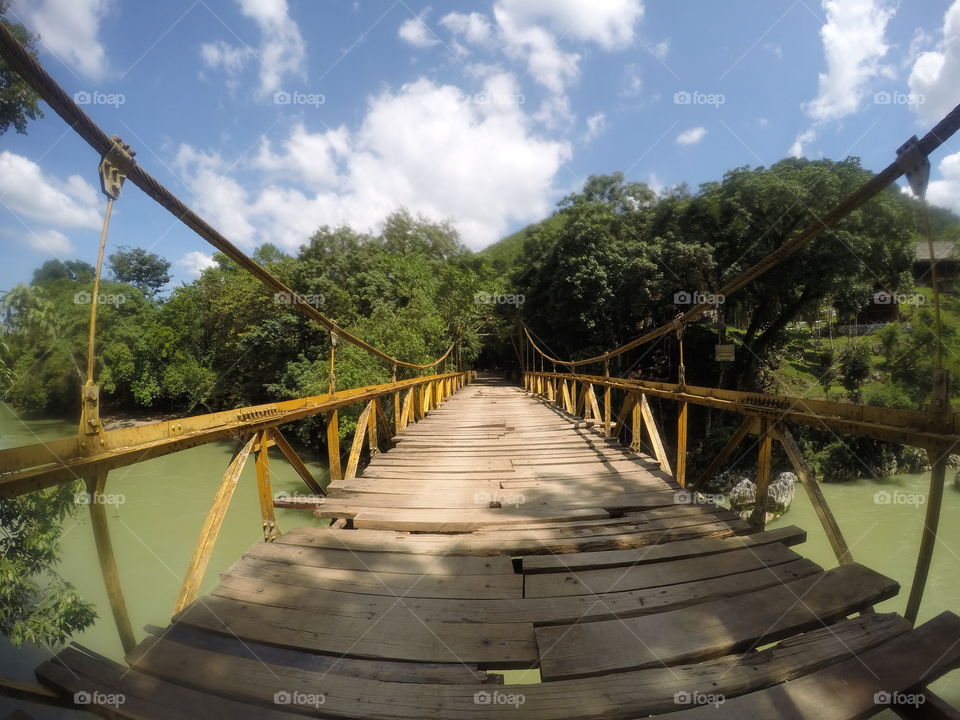 Rickety old bridge across the river at the Semuc Champey nature reserve,  Guatemala