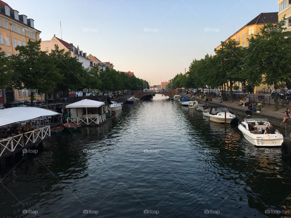 View of a canal in late afternoon in the summertime in Copenhagen, Denmark. 